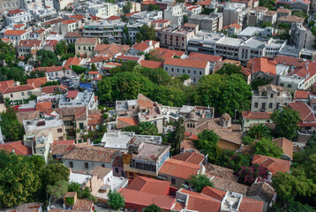 Fototapeta na wymiar Top view of the red tiled roofs of old houses in Athens