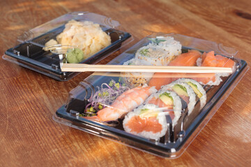 Set of Sushi, original style Japanese food pack at market. Container