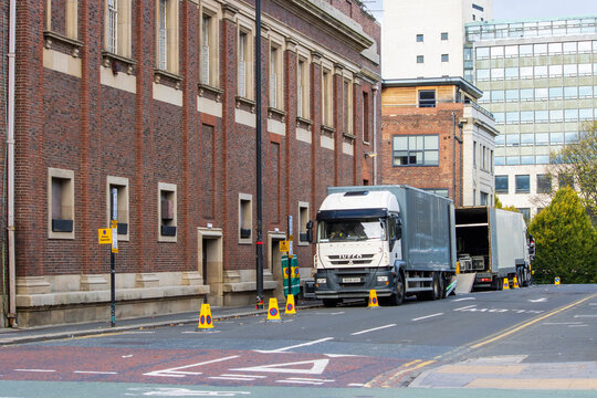 NEWCASTLE UPON TYNE, UNITED KINGDOM - Nov 06, 2021: Newcastle, UK - November 6th 2021: Road Crew Unloading Trucks At