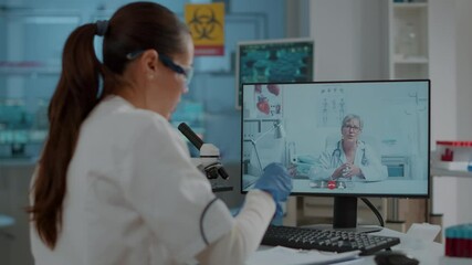 Woman scientist meeting with expert on online video conference, discussing about medical research for experiment. Chemistry worker using remote tele conference to talk to specialist.