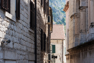 Ancient street, historical building in the old town of Kotor, Montenegro, Europe, Adriatic sea and mountains