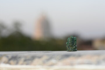 Fototapeta premium Closeup focus of lord ganesha god of green aventurine crystal