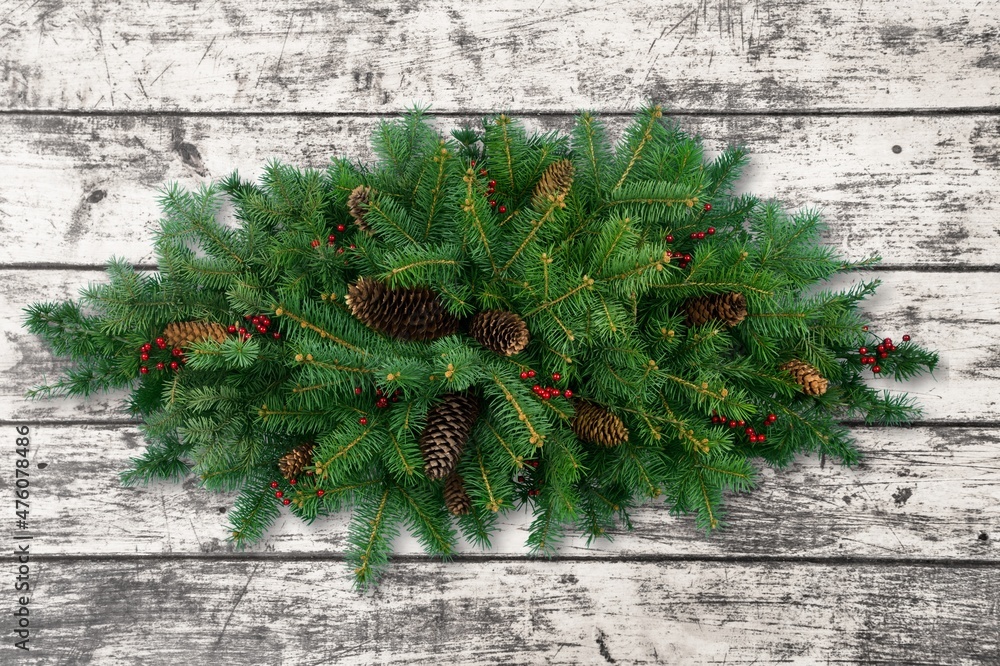 Poster Holiday's greeting card with a realistic garland of pine tree branches. Wide green Christmas decoration.