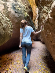 woman explore cave and canyon