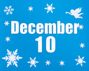 December 10th. Winter blue background with snowflakes, angel and a calendar date. Day 10 of month.