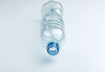 an empty plastic bottle in blue colors