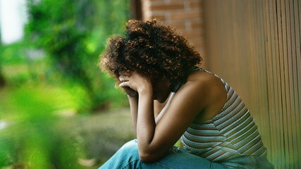 Victim woman covering face with hands feeling shame and loneliness