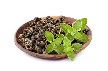 Fresh melissa leaves with green tea on a white background, Herbal medicine.