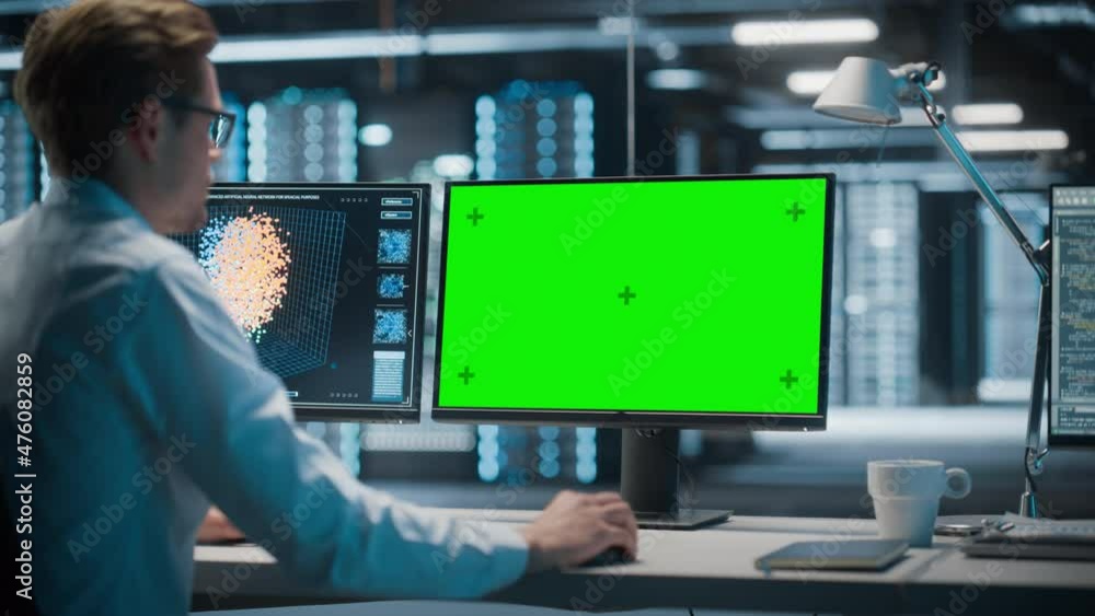 Poster High-Tech Data Center Server: Male IT Specialist Working on Green Screen Chroma Key Computer. Monitoring Web Services, Cloud Computing, Analytics Facility, Maintenance of Cyber Security