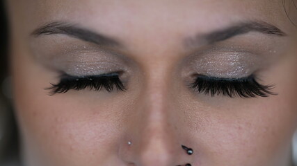 Obraz premium Woman eyes macro close-up closing eye in meditation. Person opening eyes looking at camera