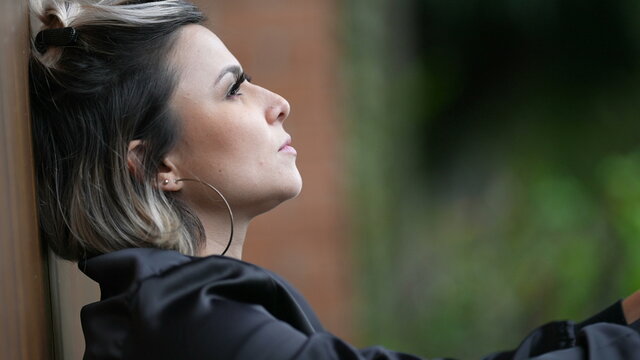 Person feeling regret covering hands with face shaking head. Woman feels shame
