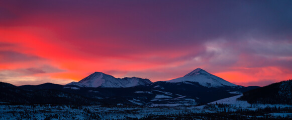 Idyllic shot of mountain range against orange sky during sunrise