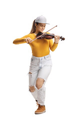 Young female violinist in jeans and yellow top playing a violin