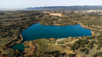 aerial photography from drone, of a lake with blue waters in the middle of nature, autumn