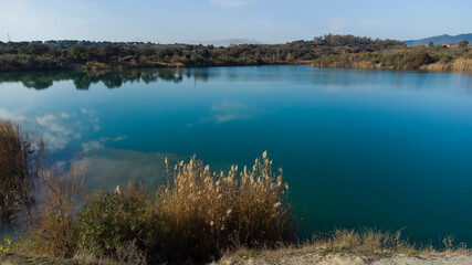 aerial photography from drone, of a lake with blue waters in the middle of nature, autumn