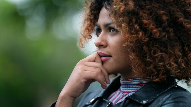 Black woman pondering solution to problem. Brazilian girl thinking contemplating solution