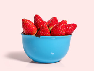 Fresh strawberries in a bowl isolated from the background