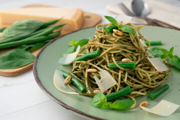 Pasta with pine nut pesto and green beans.