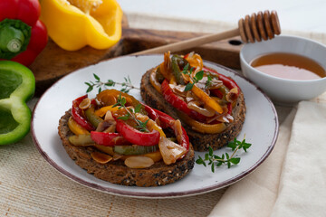 Toasts of bread with peppers and almonds. Traditional spanish tapa.