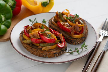 Toasts of bread with peppers and almonds. Traditional spanish tapa.