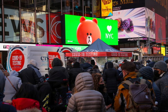 People wait to be tested for COVID-19 in Times Square in Manhattan, New York City
