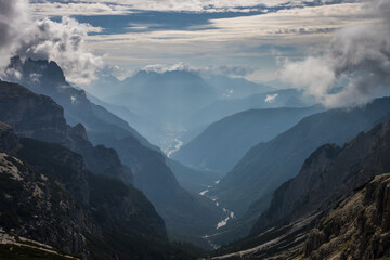 Clouds over mountain trail Tre Cime di Lavaredo in Dolomites