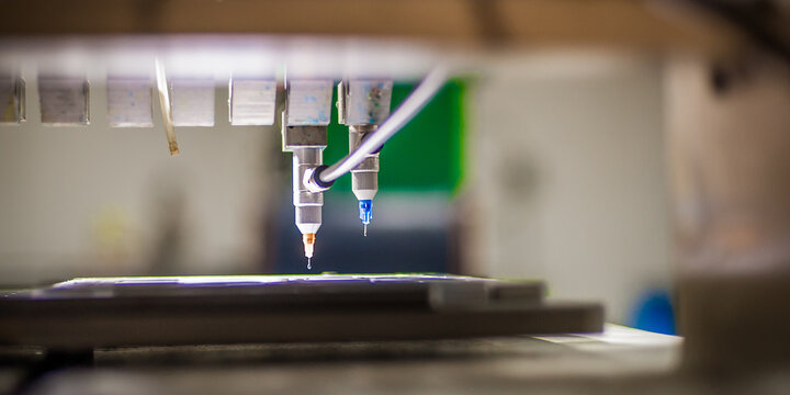 Closeup detail view of soft PVC dispensing machine head