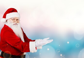 Fototapeta na wymiar Funny happy excited old bearded Santa Claus face wearing costume looking at camera.