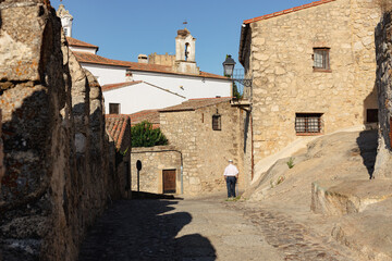 Old stone buildings in the narrow cobbled streets of the medieval city of Trujillo at sunset, Caceres, Extremadura, Spain