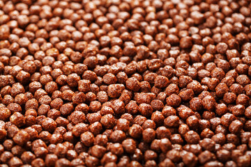 Ready breakfast chocolate balls texture close-up, background