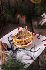 Christmas decorations and coniferous branches on wooden background