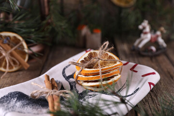 Christmas decorations and coniferous branches on wooden background