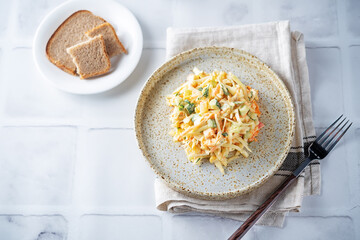 Coleslaw, cabbage cucumber corn carrot salad with greek yogurt dressing in a bowl