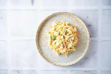Coleslaw, cabbage cucumber corn carrot salad with greek yogurt dressing in a bowl