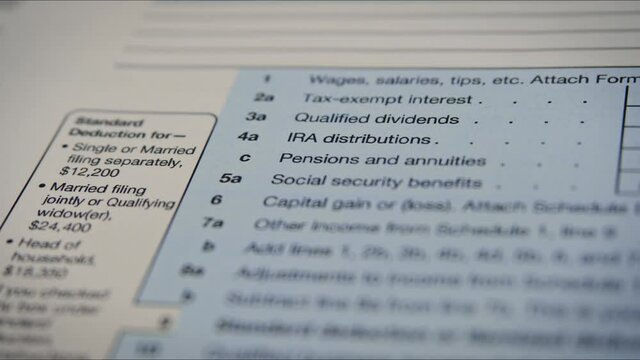 Blank Form 1040 U.S. individual income tax return. Tax payment time concept. Filing taxes document