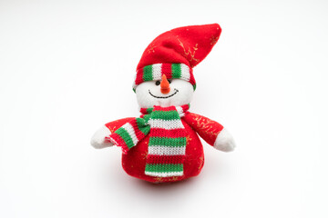 Funny toy snowman in a hat and scarf. Christmas tree decoration.