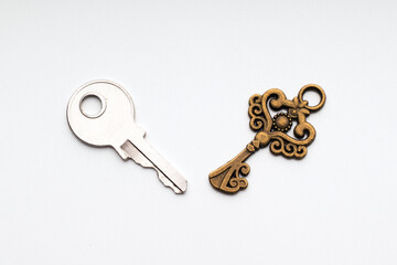 Simple key and ornate key. Simplicity and practicality versus feature, decorative detail for more attractiveness, concept