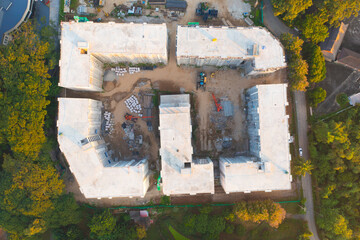 Aerial top view of apartment in village under construction site with structure. Top view of precast concrete slap floor. Development architecture buildings.
