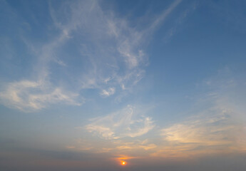 Sunset sky. Abstract nature background. Dramatic blue with orange colorful clouds in twilight time.