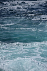 Naklejka na ściany i meble Blue water with fresh surf background
