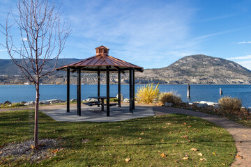 A gazebo in a lakeside park in the mountains