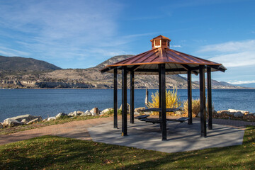 An empty gazebo in a park by the lake