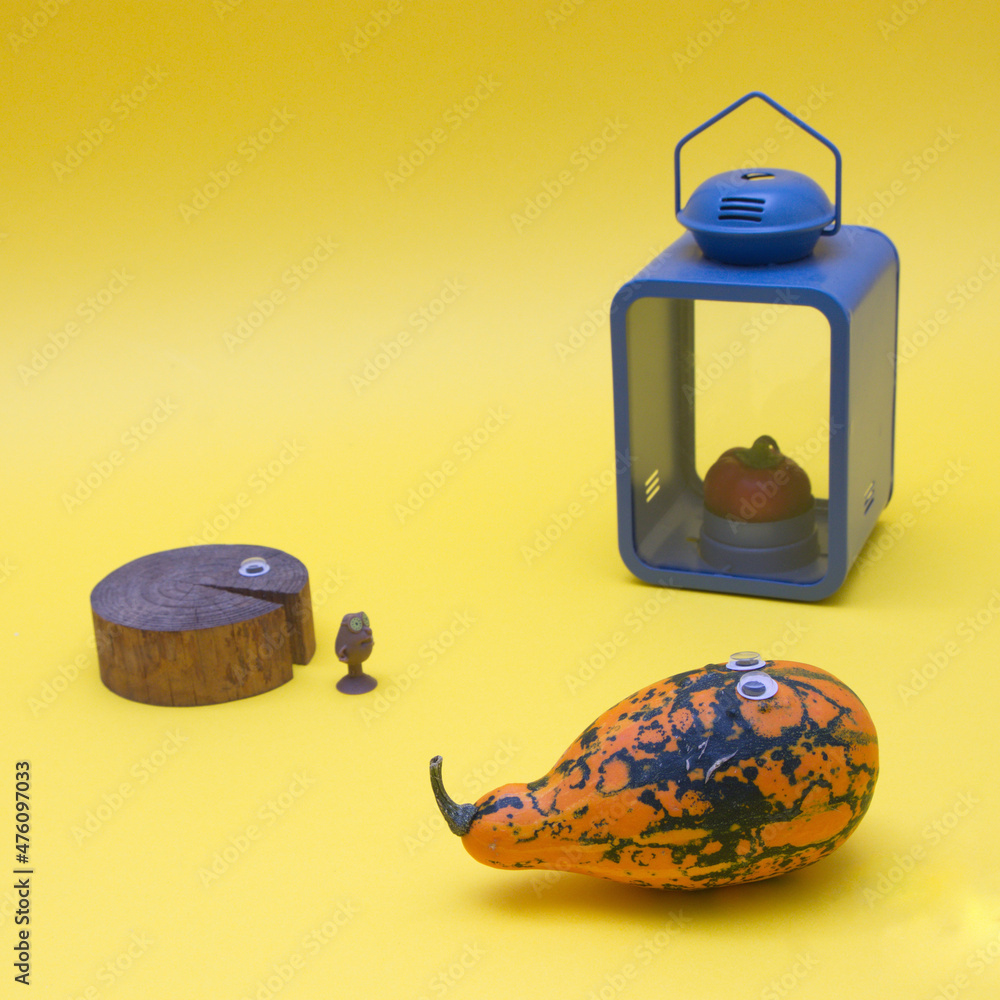 Poster pumpkin and an old tree with eyes and a blue lantern with red pepper instead of a candle