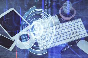 Double exposure of technology theme drawing over work table desktop. Top view. Global data analysis concept.