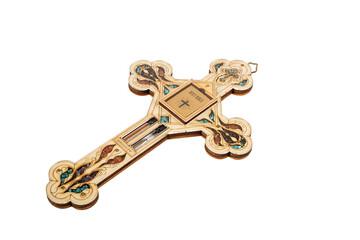 Wooden crucifix standing with holy water and bible on white background.