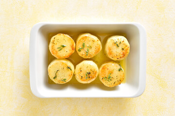 Fondant potatoes in baking dish