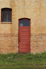 Close-up Building Detail Historical Brick Wall With Doors and Windows