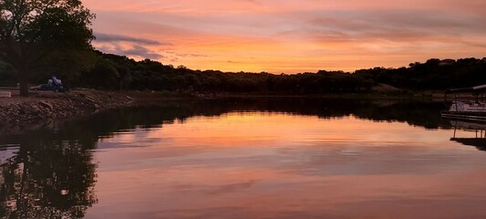 Fototapeta na wymiar Sunset reflecting off lake