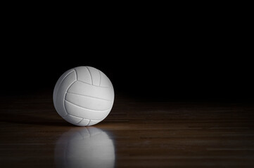 Volleyball ball on wooden court. Horizontal education and sport poster, greeting cards, headers, website