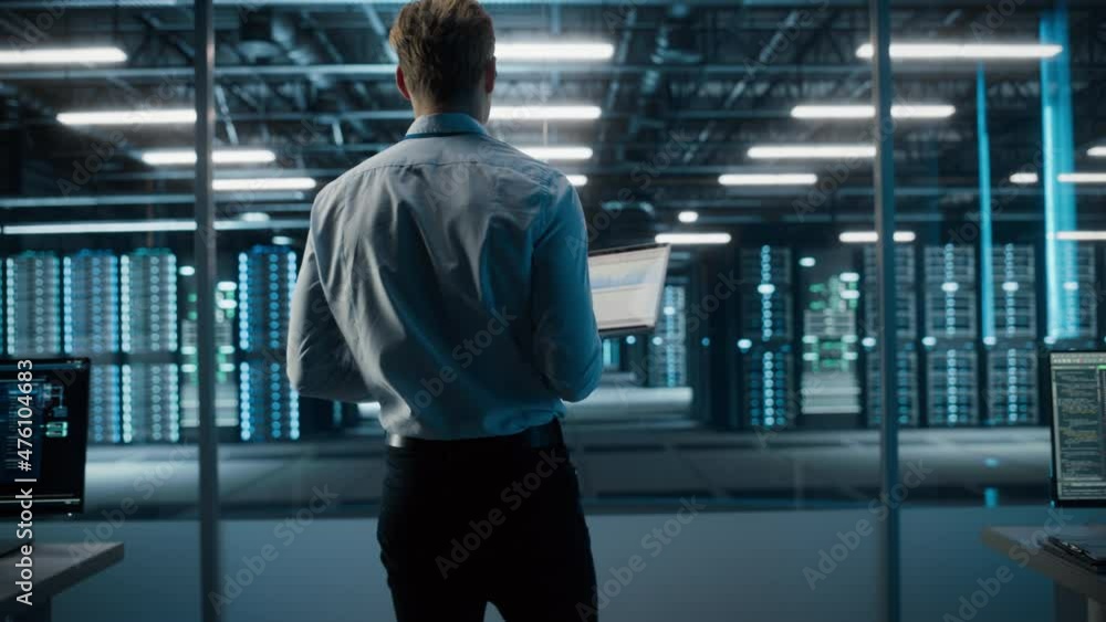 Fototapete Big Data Center Specialist Engineer Using Laptop Computer. Server Farm Cloud Computing Facility with System Administrator Working. Software as Solution and Cloud Computing with Cyber Security